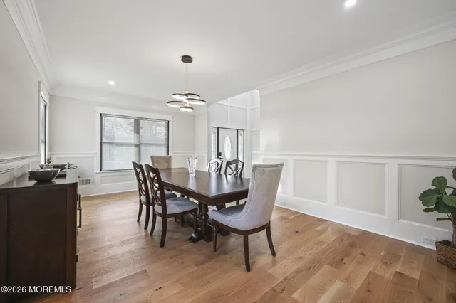 a kitchen with stainless steel appliances a sink stove and cabinets