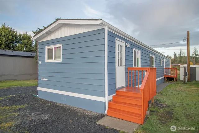 a backyard of a house with barbeque oven