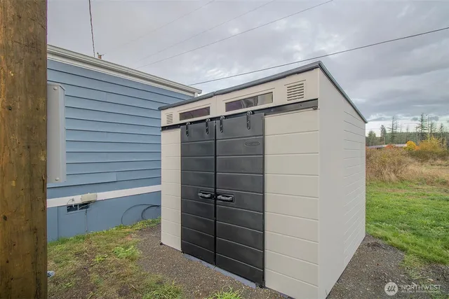 a bathroom with a shower and a sink