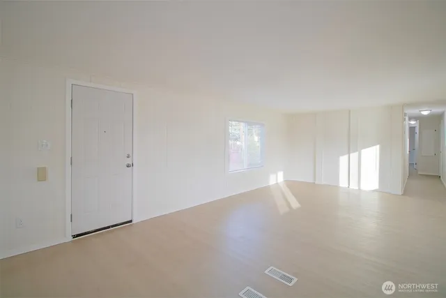 a view of an empty room with a window