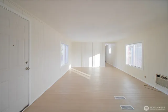 a view of an empty room with a window