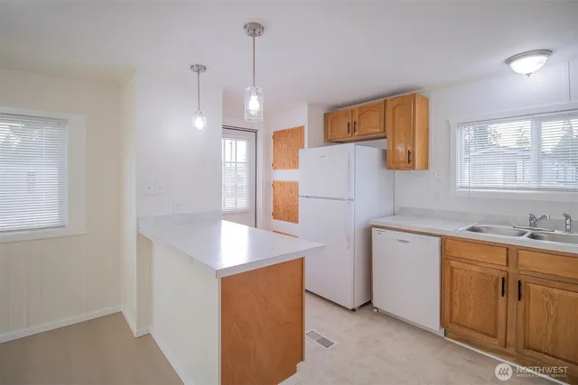 a kitchen with sink cabinets and window