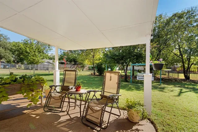 a view of yard with seating area and green space