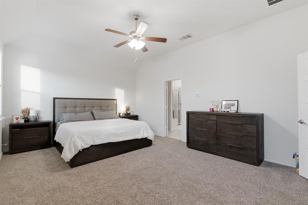 727 Fort Lane Fate, TX 75189 - Photo 13 of 19 a bedroom with a bed and cabinet