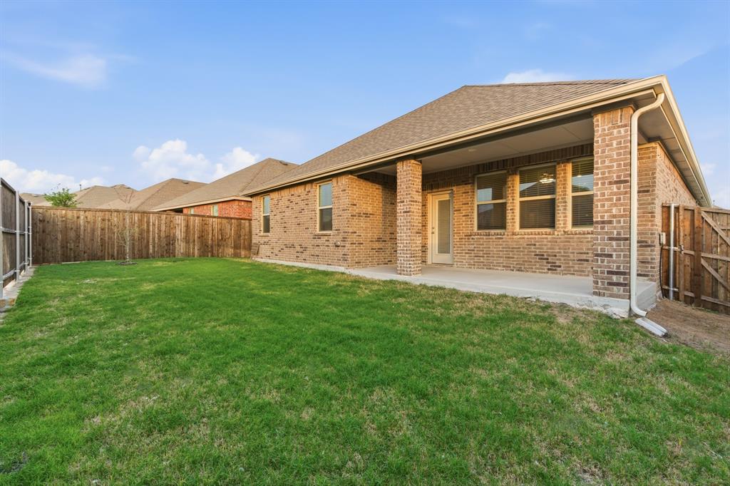 727 Fort Lane Fate, TX 75189 - Photo 19 of 19 a backyard of a house with lots of green space