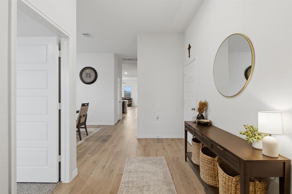 727 Fort Lane Fate, TX 75189 - Photo 3 of 19 a very nice looking room with a chair