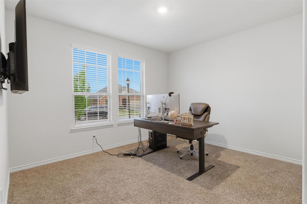 727 Fort Lane Fate, TX 75189 - Photo 4 of 19 a view of a workspace with furniture and a window