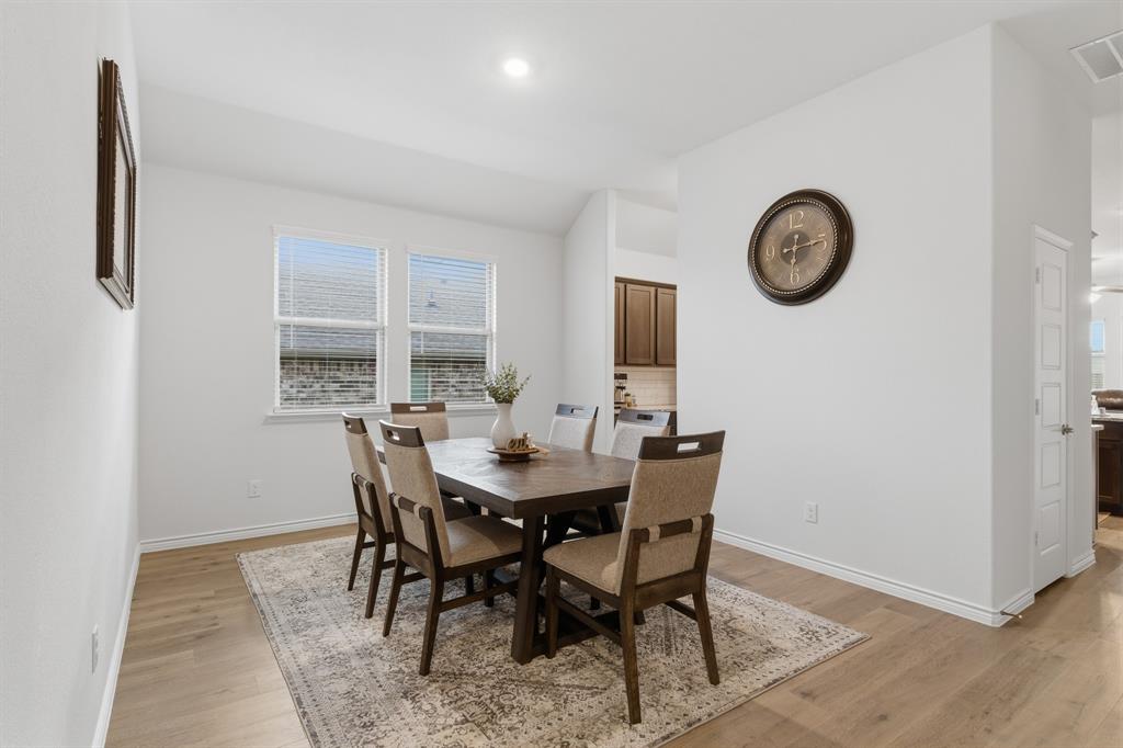 727 Fort Lane Fate, TX 75189 - Photo 5 of 19 a view of a dining room with furniture and a window