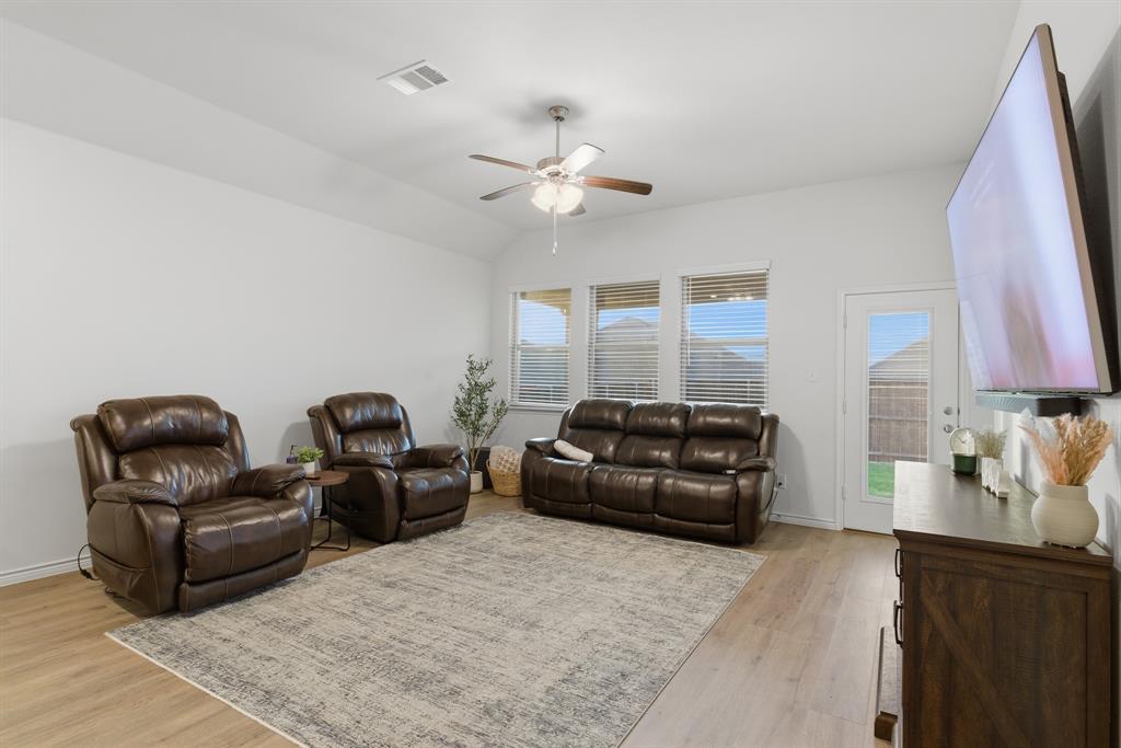 727 Fort Lane Fate, TX 75189 - Photo 6 of 19 a living room with furniture and a lamp
