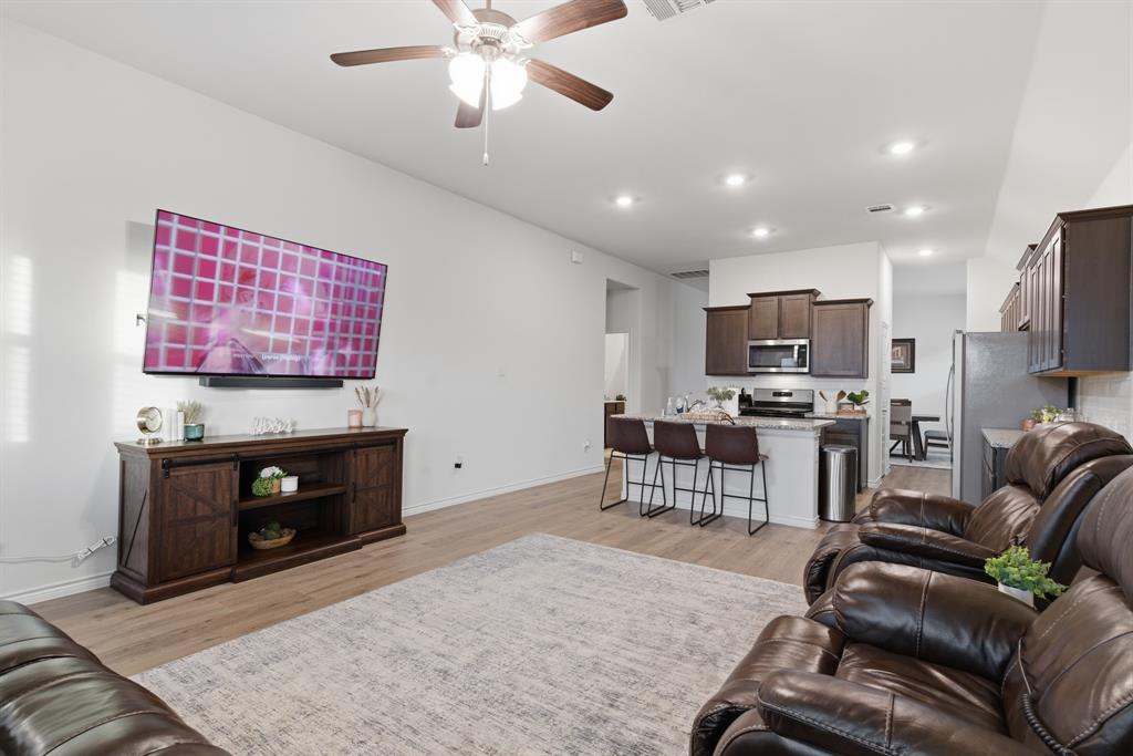 727 Fort Lane Fate, TX 75189 - Photo 7 of 19 a living room with furniture and a fireplace