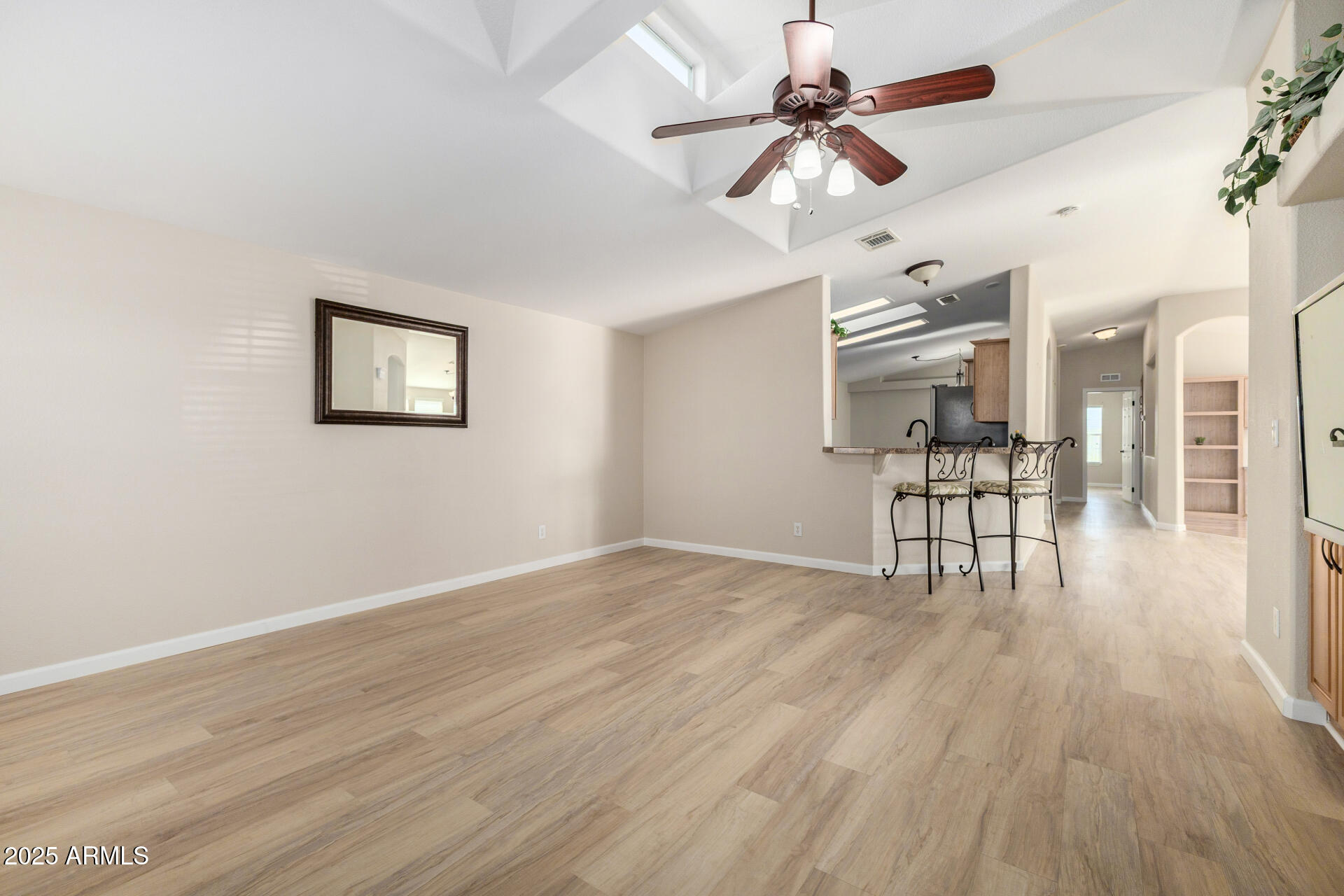 3301 South Goldfield Road, Unit 4018 Apache Junction, AZ 85119 - Photo 16 of 45 a view of empty room with wooden floor