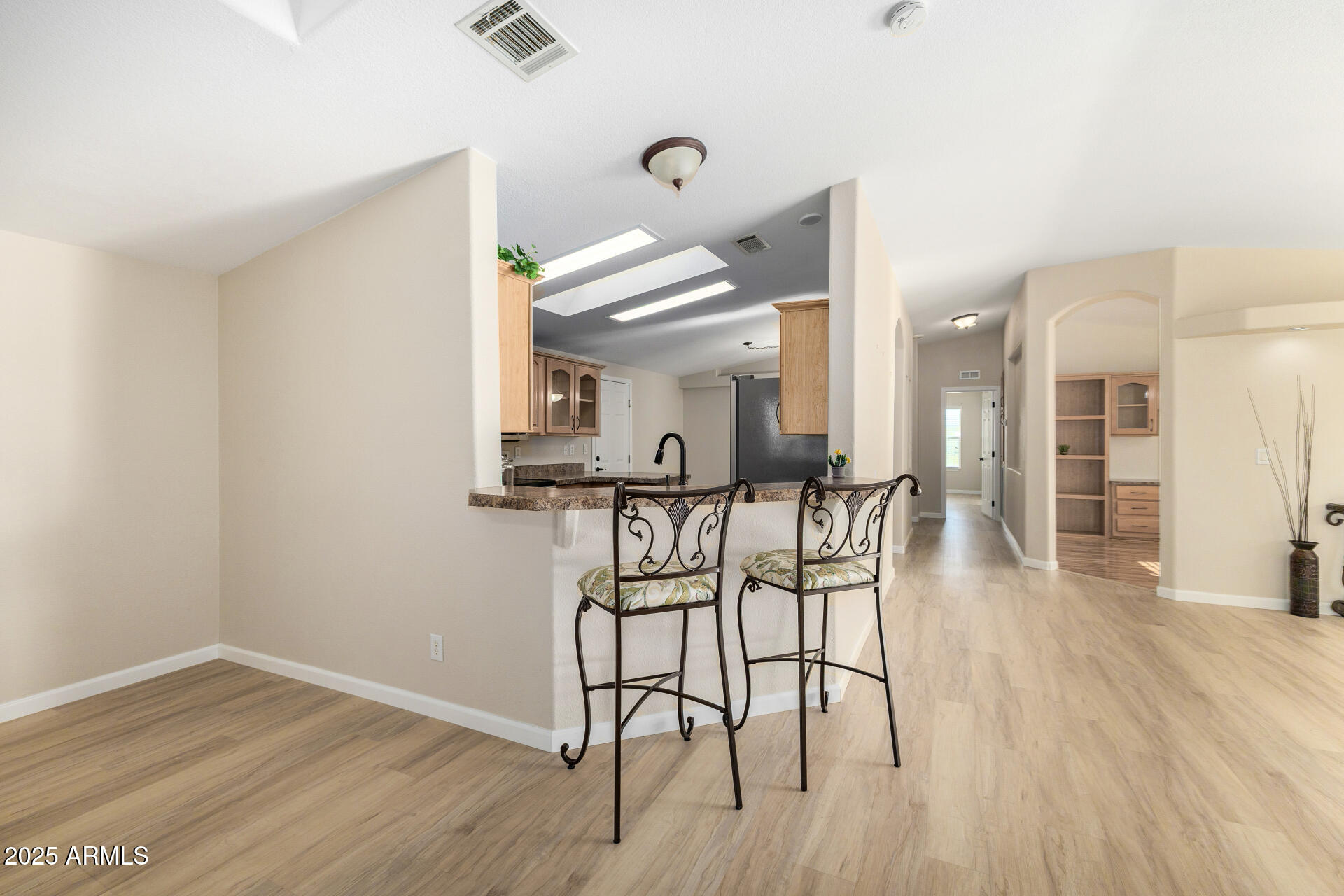 3301 South Goldfield Road, Unit 4018 Apache Junction, AZ 85119 - Photo 18 of 45 a view of a room with wooden floor and windows