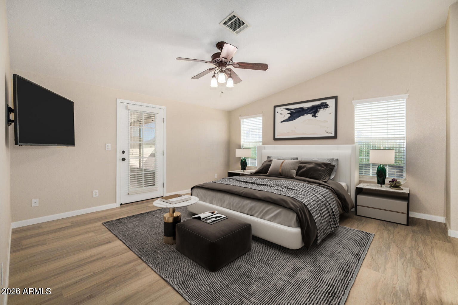 3301 South Goldfield Road, Unit 4018 Apache Junction, AZ 85119 - Photo 3 of 45 a spacious bedroom with a bed and a flat screen tv