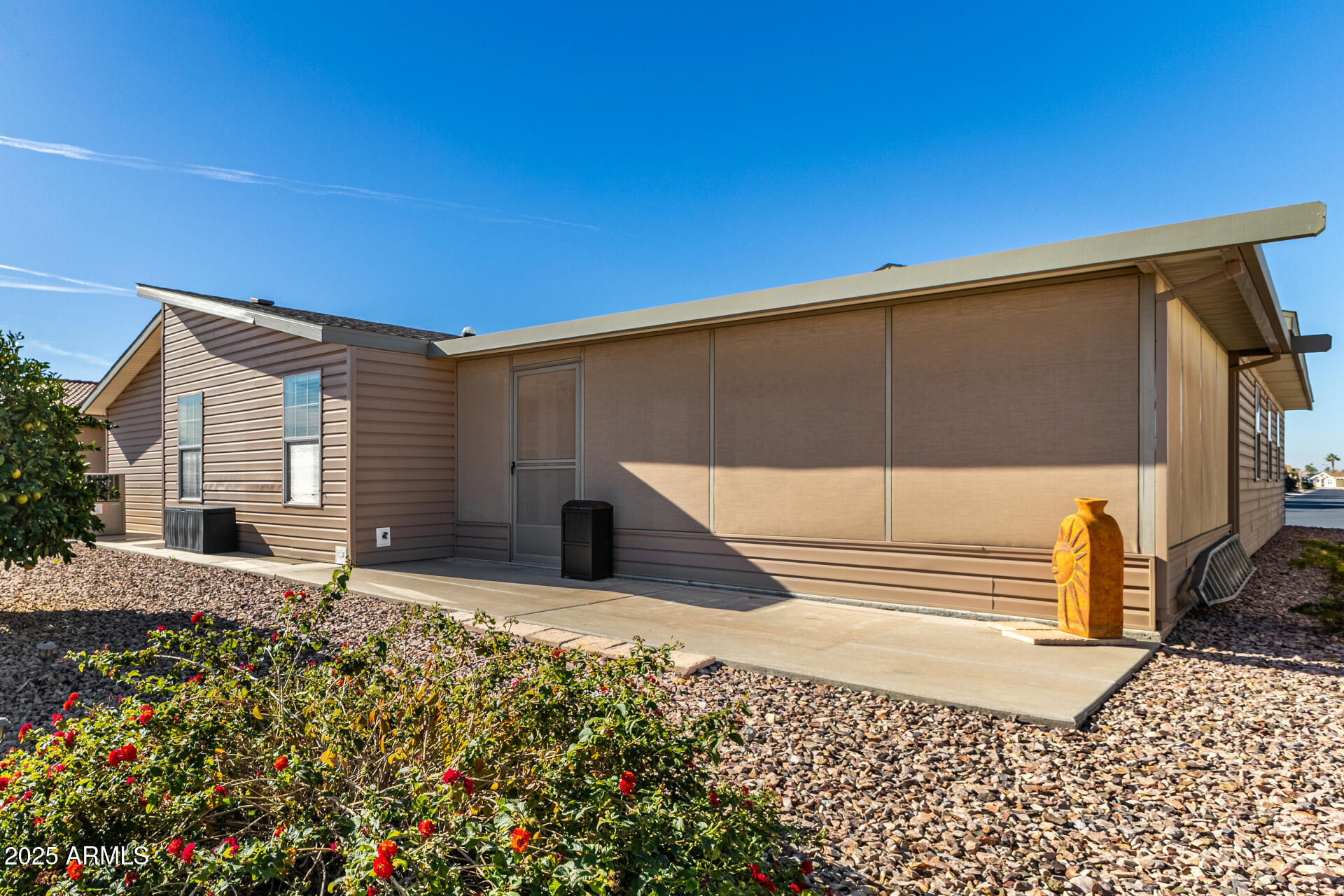 3301 South Goldfield Road, Unit 4018 Apache Junction, AZ 85119 - Photo 35 of 45 a house view with a backyard