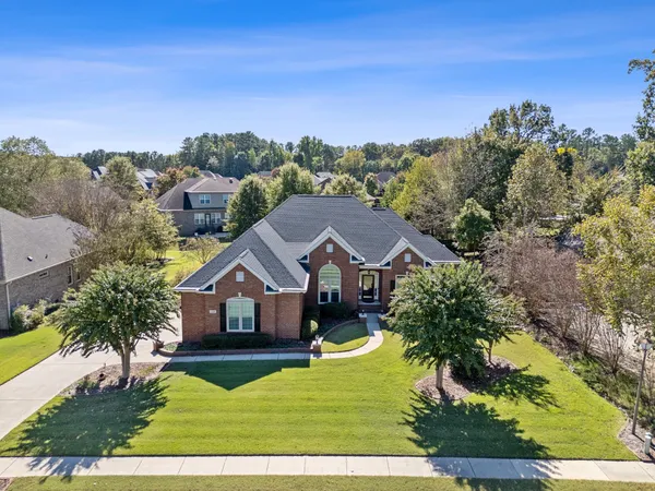 a view of house with yard