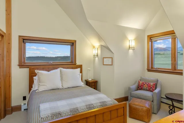 a blue chair sitting next to a blue wall