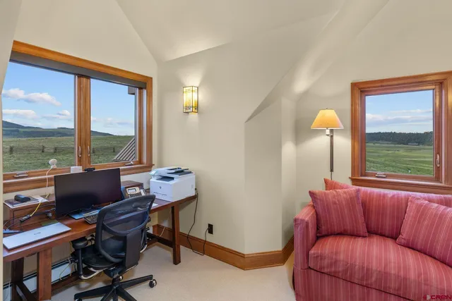 an aerial view of a house with outdoor space