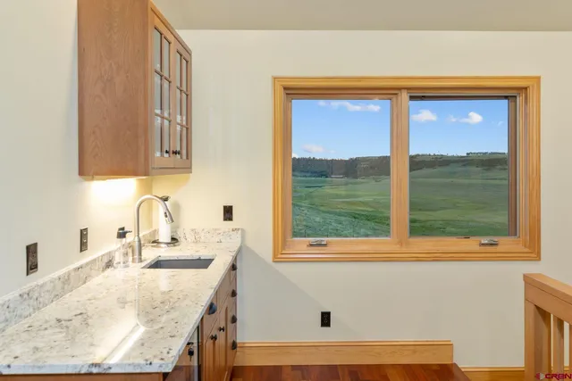 a view of parking garage with cars and other equipment