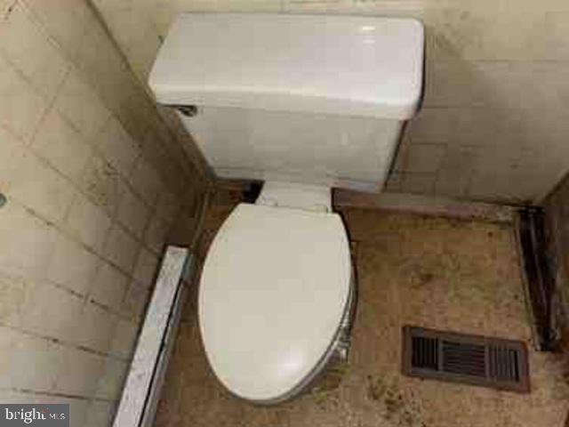 471 Griffith Road Tyler Hill, PA 18469 - Photo 11 of 11 a bathroom with a toilet and a sink