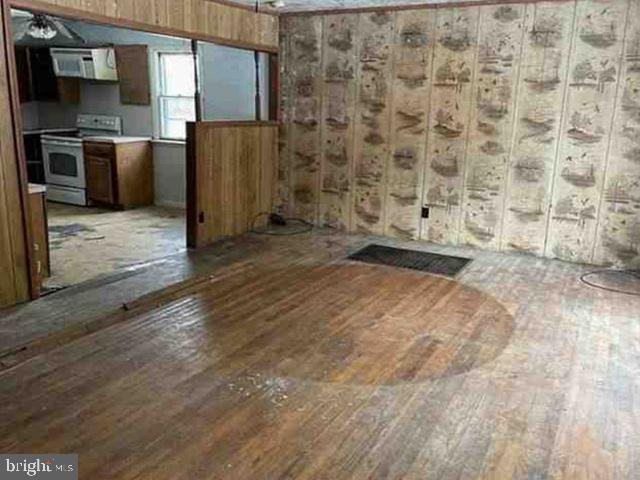 471 Griffith Road Tyler Hill, PA 18469 - Photo 5 of 11 a view of a refrigerator in kitchen and wooden floor