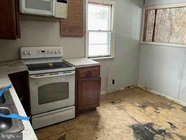 471 Griffith Road Tyler Hill, PA 18469 - Photo 6 of 11 a stove top oven sitting inside of a kitchen