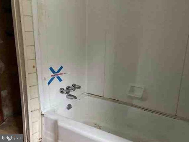 471 Griffith Road Tyler Hill, PA 18469 - Photo 10 of 11 a bathroom with a bathtub and a shower