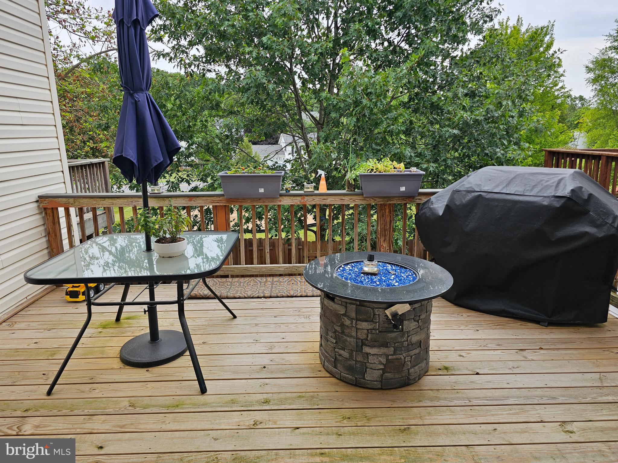 120 Eagles Ridge Smithsburg, MD 21783 - Photo 6 of 22 a view of a patio with table and chairs barbeque potted plants and large tree