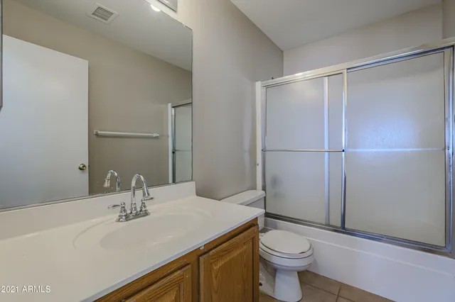 a bathroom with a sink toilet and vanity
