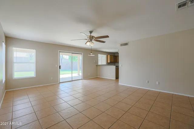 a view of a kitchen with a sink and a window