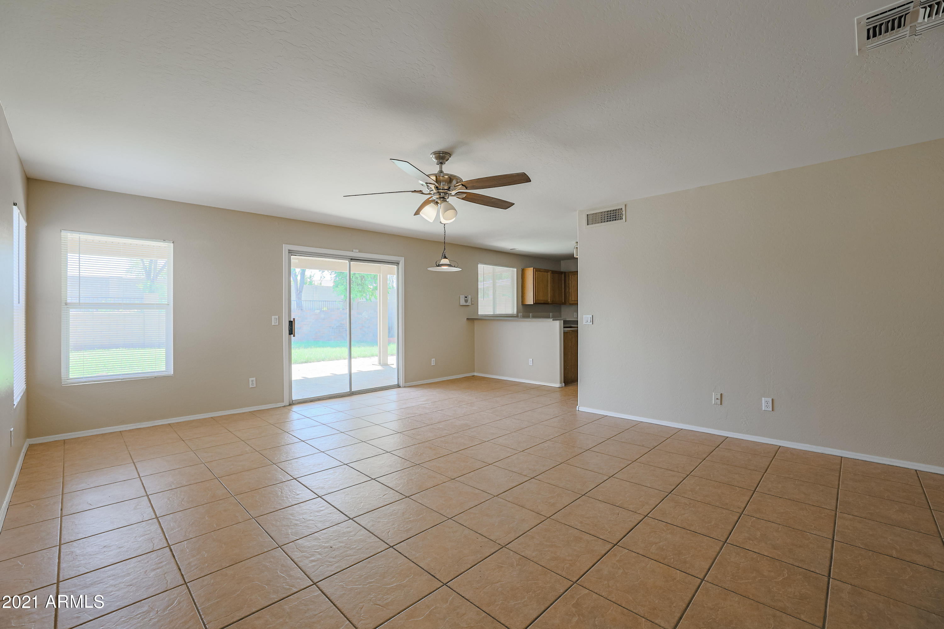 4349 North 111th Lane Phoenix, AZ 85037 - Photo 2 of 18 a view of a kitchen with a sink and a window