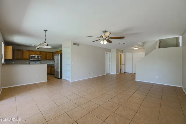 a view of a kitchen with a sink and cabinet