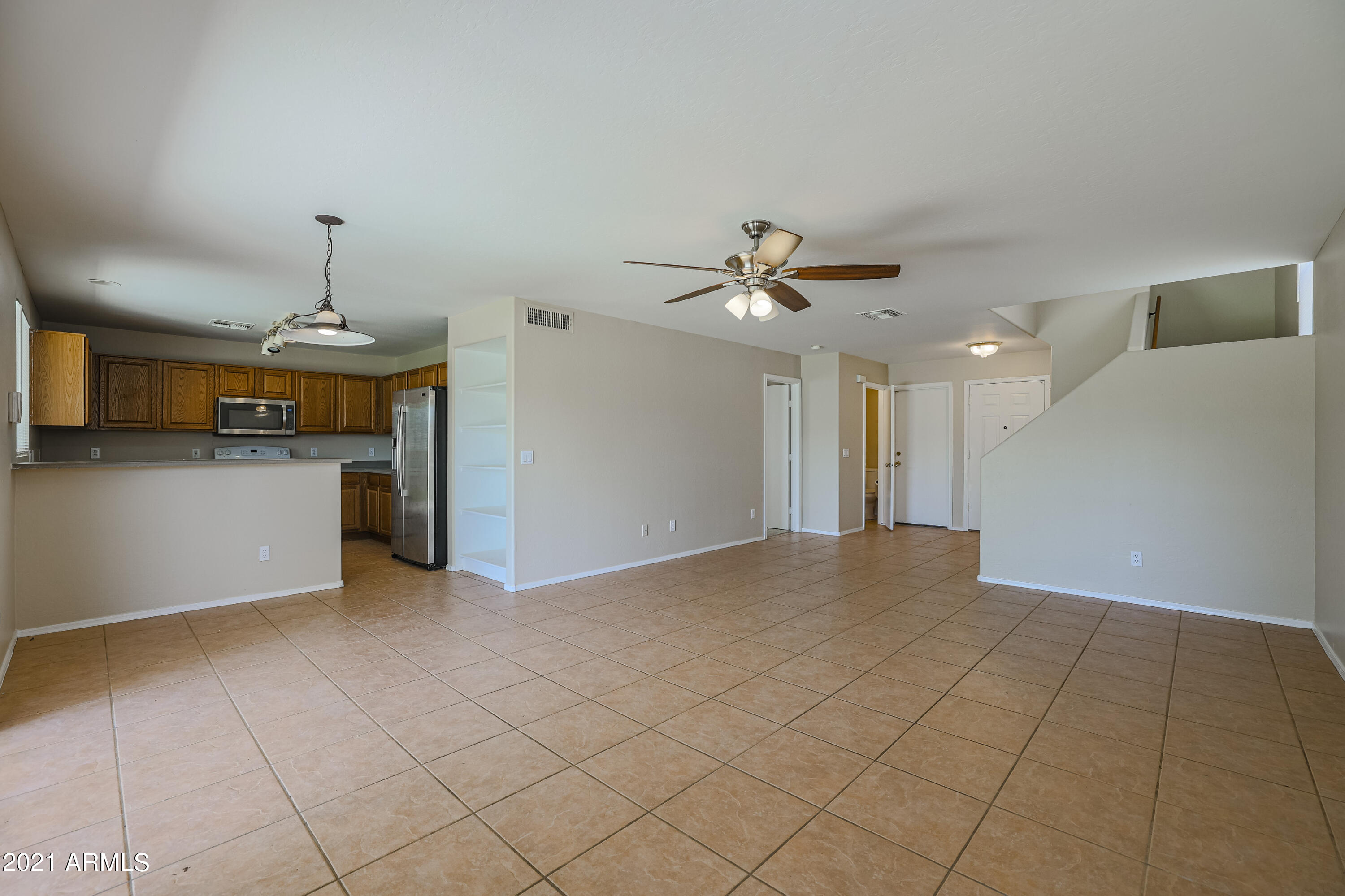 4349 North 111th Lane Phoenix, AZ 85037 - Photo 3 of 18 a view of a kitchen with a sink and cabinet
