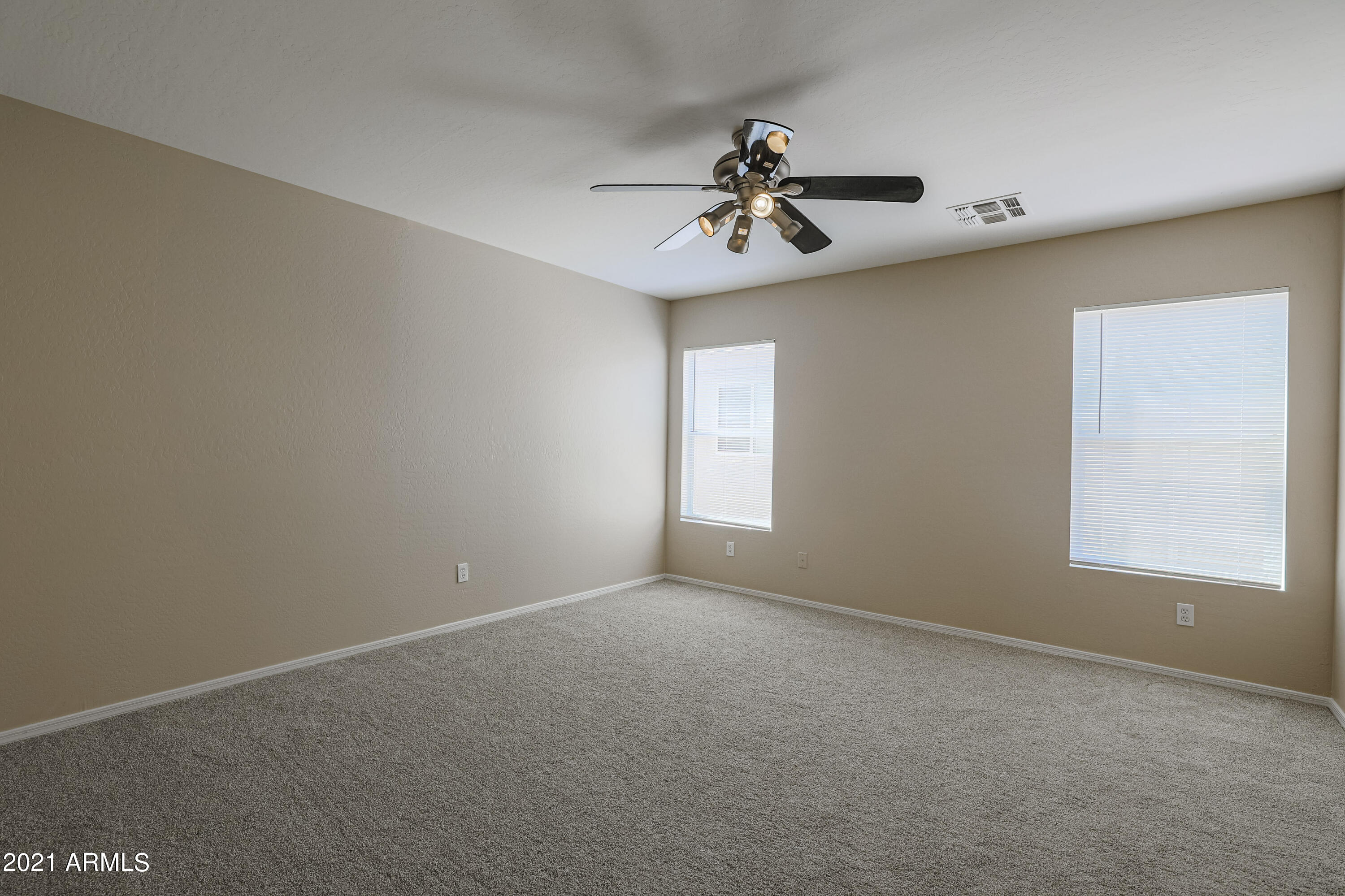 4349 North 111th Lane Phoenix, AZ 85037 - Photo 7 of 18 a view of a livingroom with a window