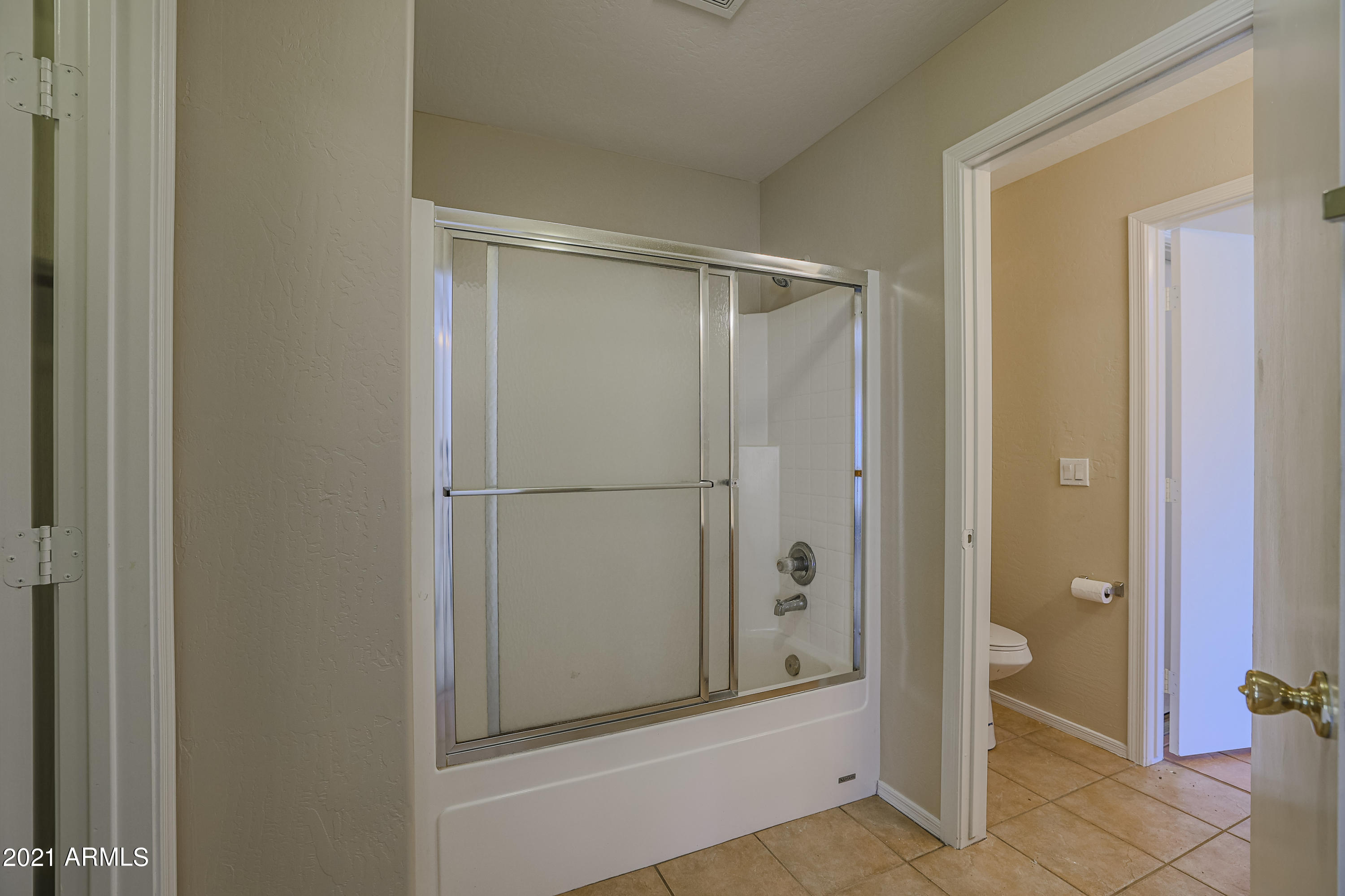 4349 North 111th Lane Phoenix, AZ 85037 - Photo 8 of 18 a view of bathroom with shower