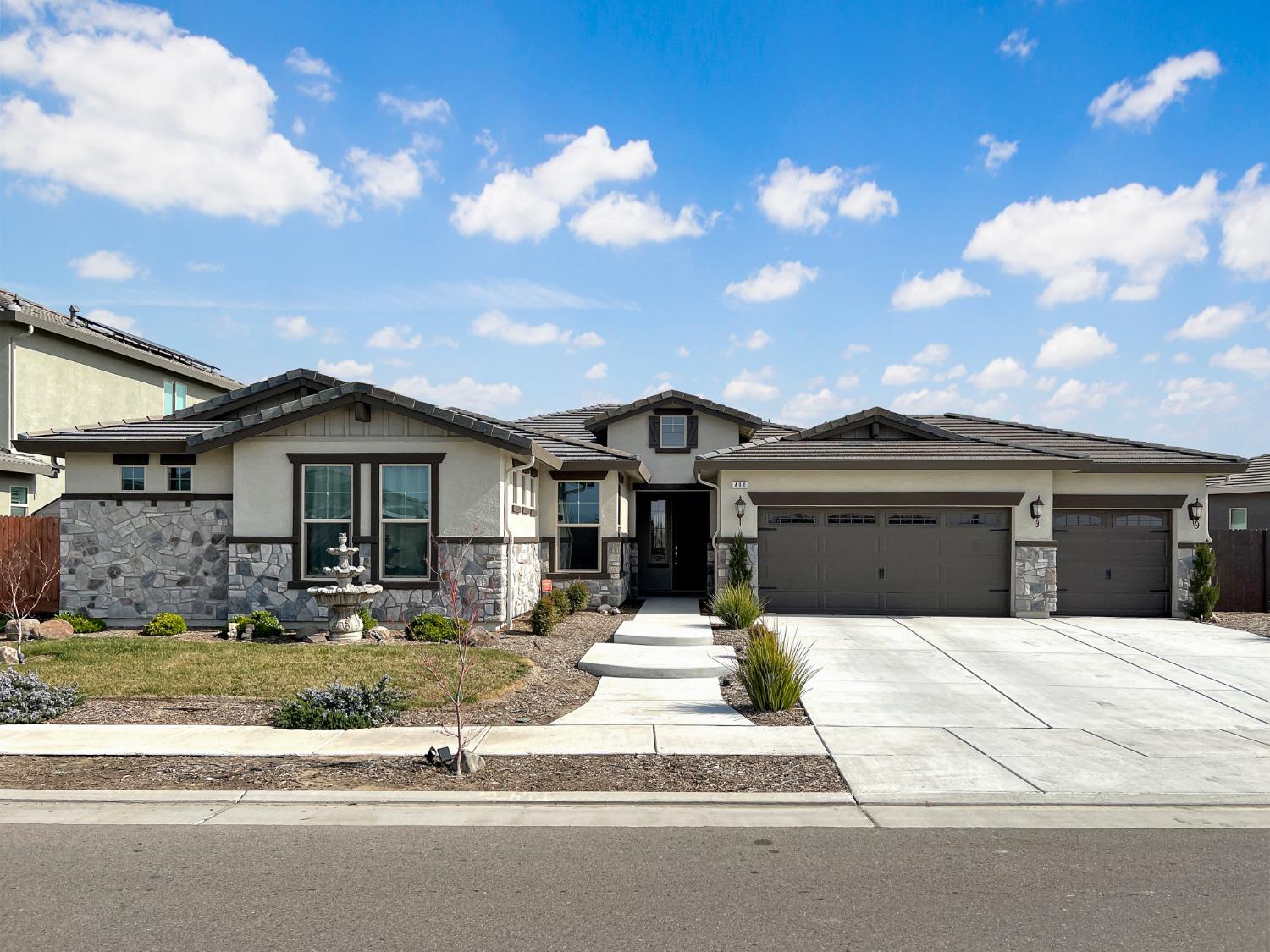 400 Ridge Creek Estates Way Dinuba, CA 93618 - Photo 1 of 49 a front view of a house with a yard