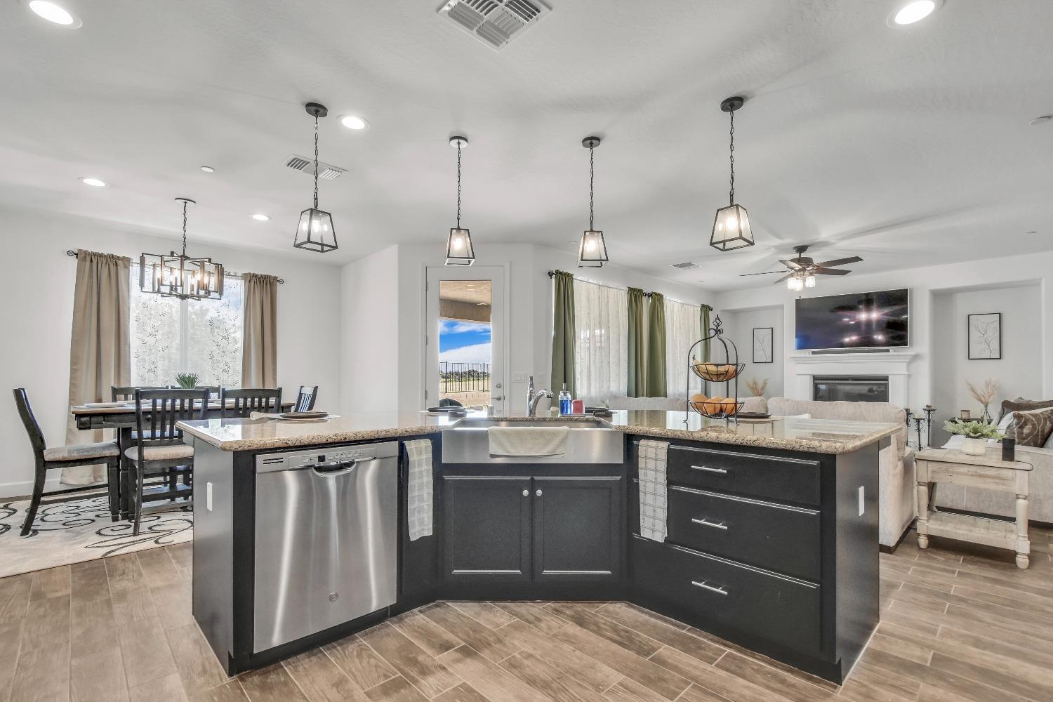 400 Ridge Creek Estates Way Dinuba, CA 93618 - Photo 14 of 49 a kitchen with lots of counter space and a sink