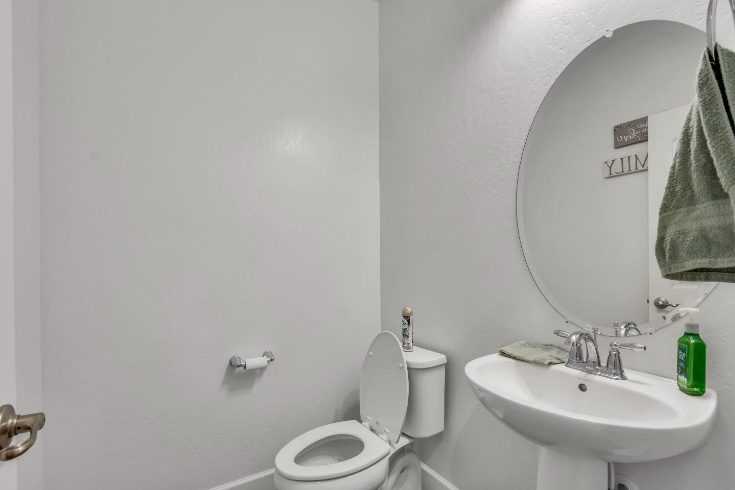 400 Ridge Creek Estates Way Dinuba, CA 93618 - Photo 20 of 49 a bathroom with a sink and a mirror