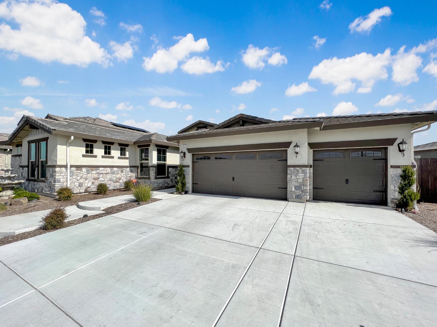 400 Ridge Creek Estates Way Dinuba, CA 93618 - Photo 3 of 49 a view of a house with a outdoor space and backyard