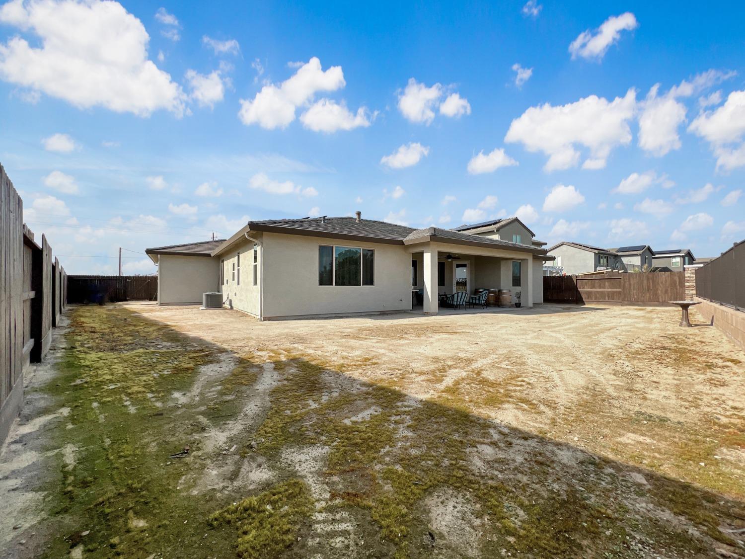 400 Ridge Creek Estates Way Dinuba, CA 93618 - Photo 38 of 49 a view of a house with a yard