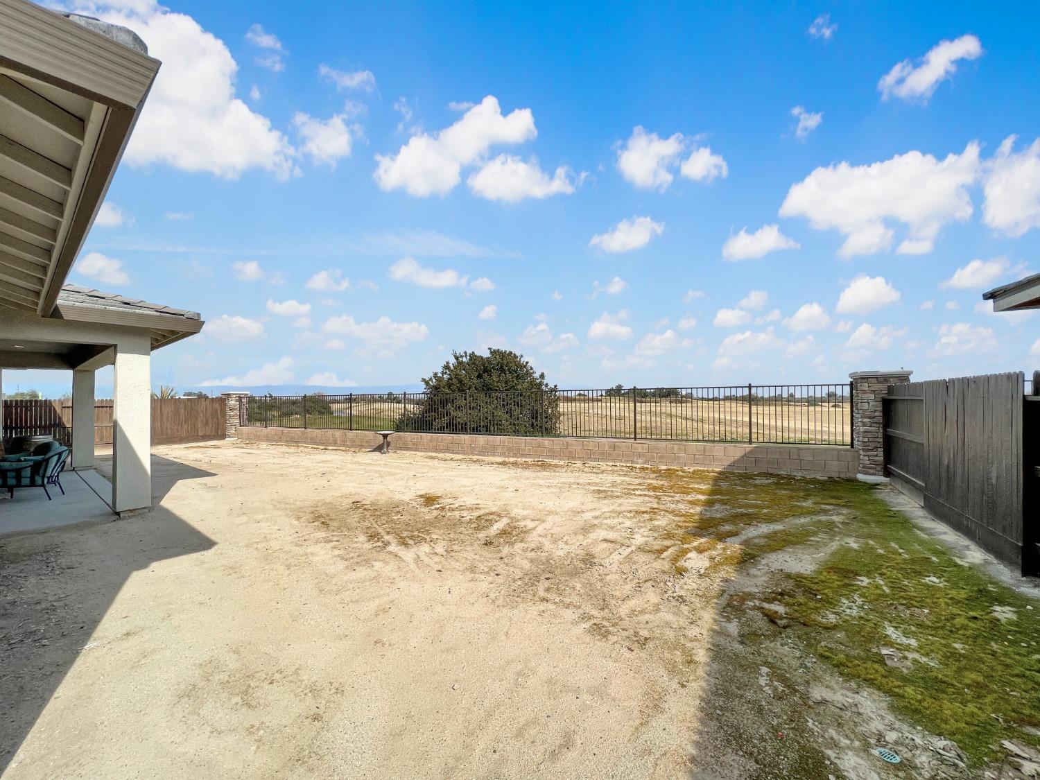 400 Ridge Creek Estates Way Dinuba, CA 93618 - Photo 39 of 49 a view of a swimming pool and an outdoor seating