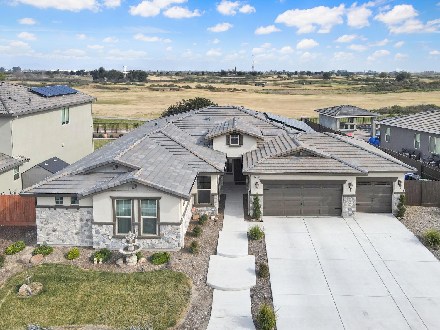 400 Ridge Creek Estates Way Dinuba, CA 93618 - Photo 40 of 49 a front view of a house with a ocean view