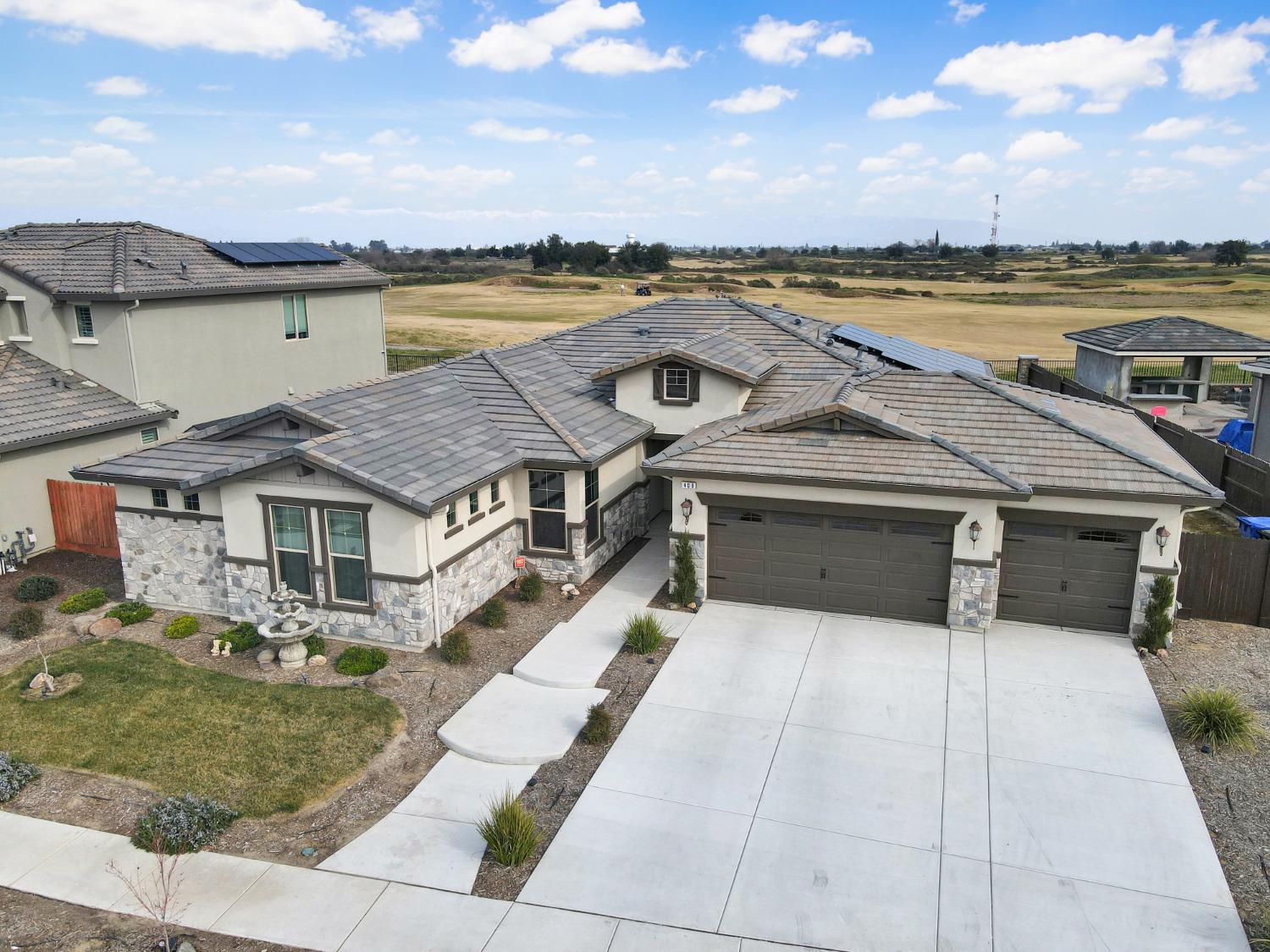 400 Ridge Creek Estates Way Dinuba, CA 93618 - Photo 41 of 49 a view of a house with a terrace