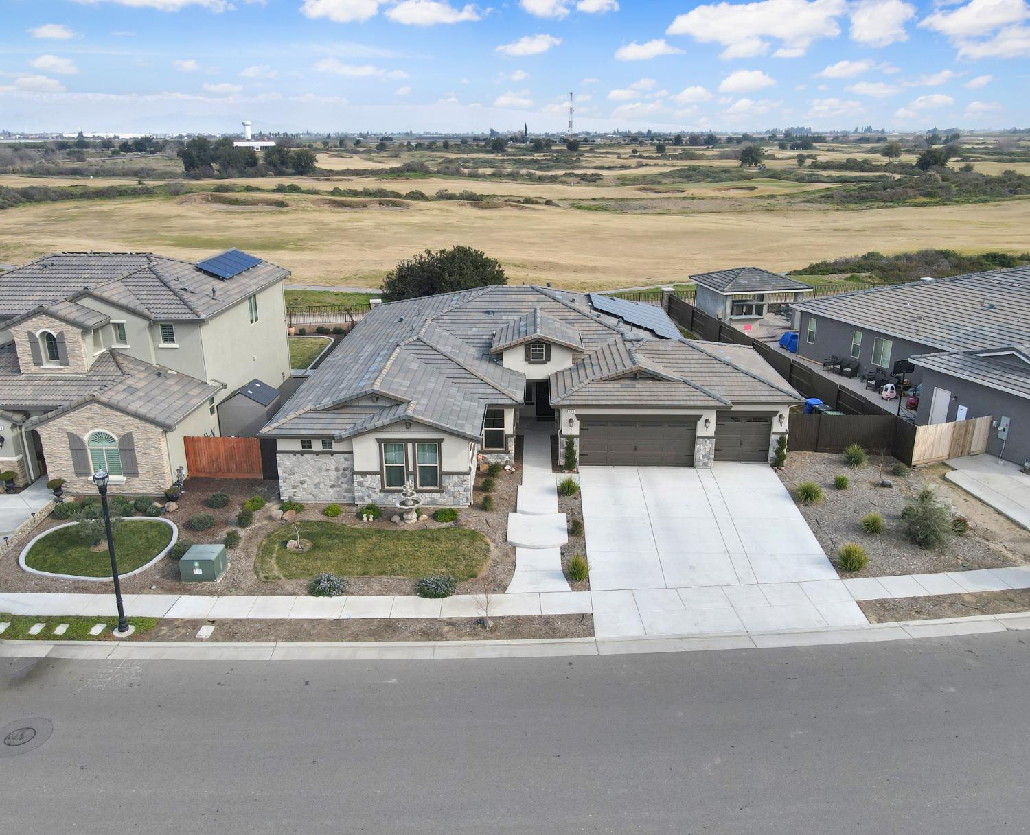 400 Ridge Creek Estates Way Dinuba, CA 93618 - Photo 43 of 49 an aerial view of a house with a ocean view