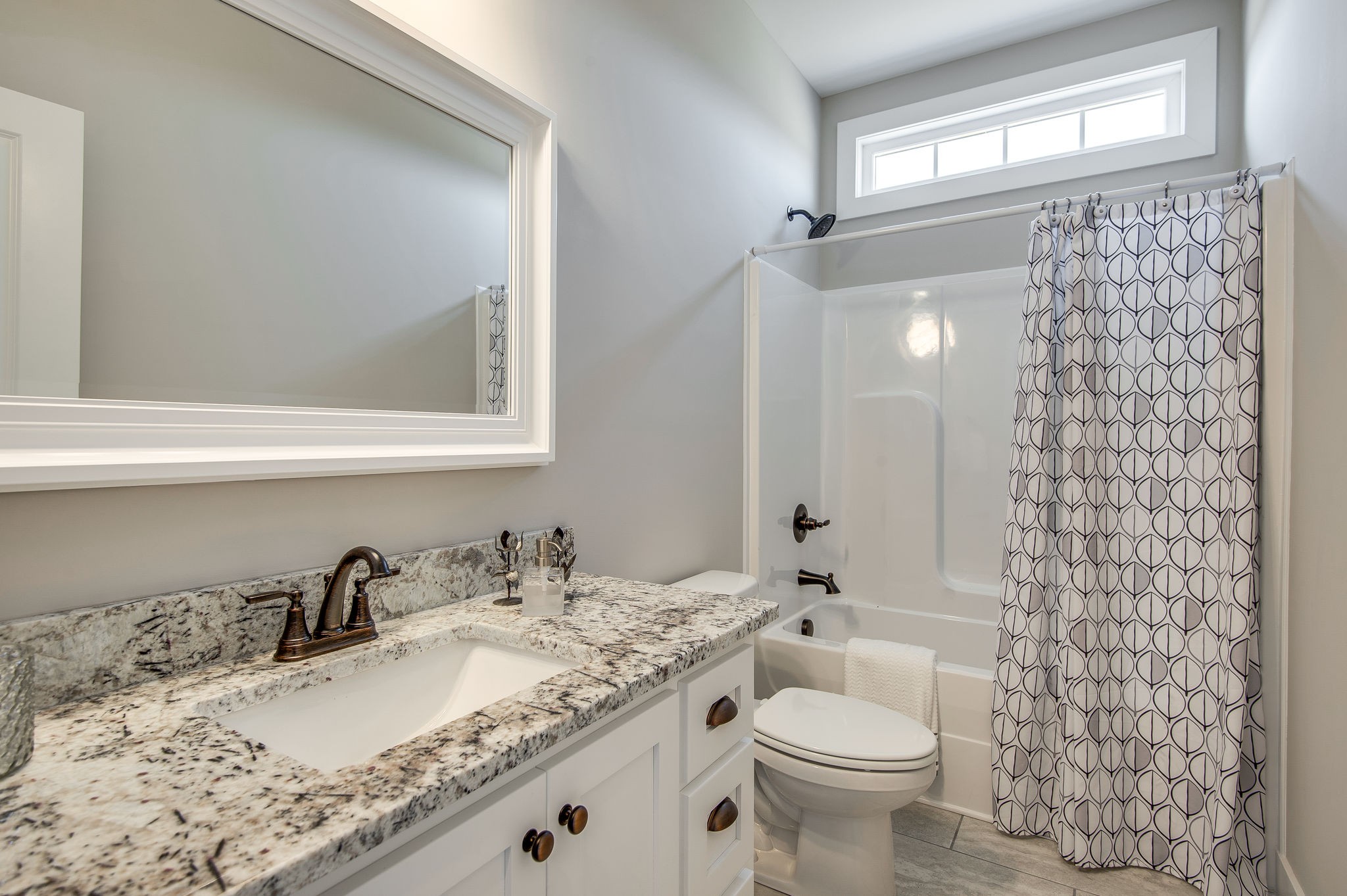1026 Hayshed Road Dickson, TN 37055 - Photo 13 of 30 a bathroom with a granite countertop sink toilet and mirror