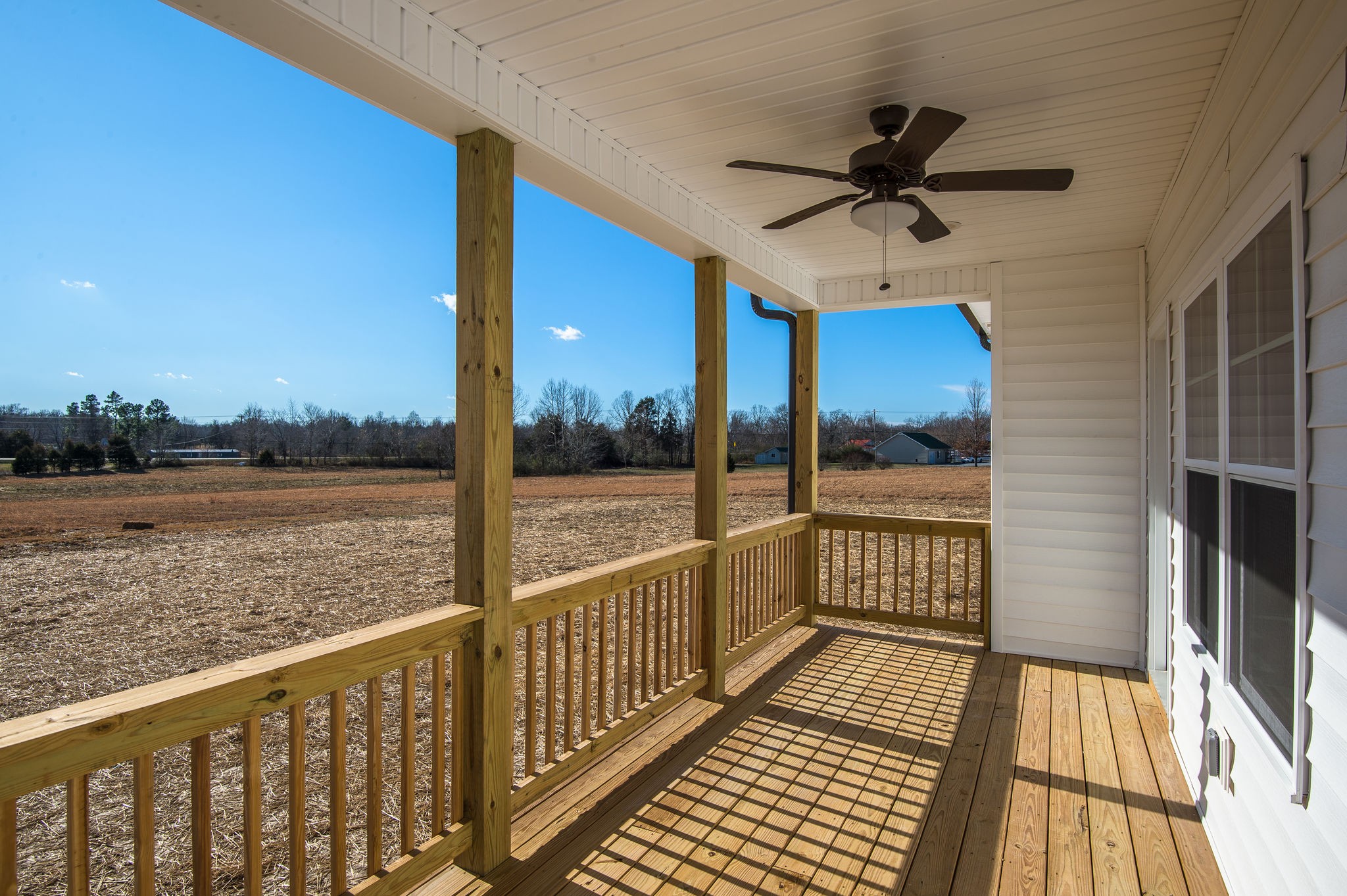 1026 Hayshed Road Dickson, TN 37055 - Photo 21 of 30 a view of a balcony with wooden floor next to a yard