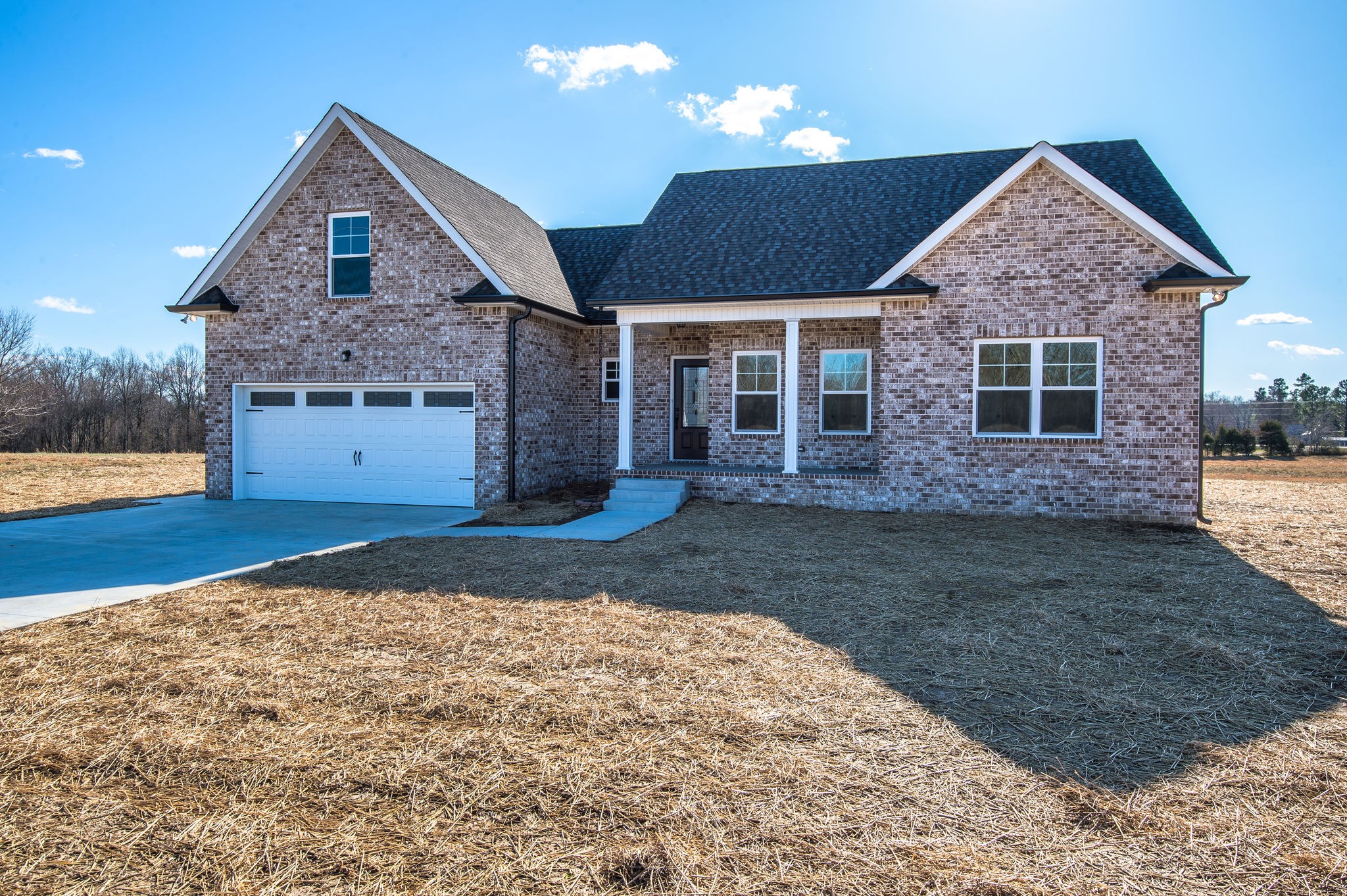 1026 Hayshed Road Dickson, TN 37055 - Photo 22 of 30 a front view of a house with a yard and garage