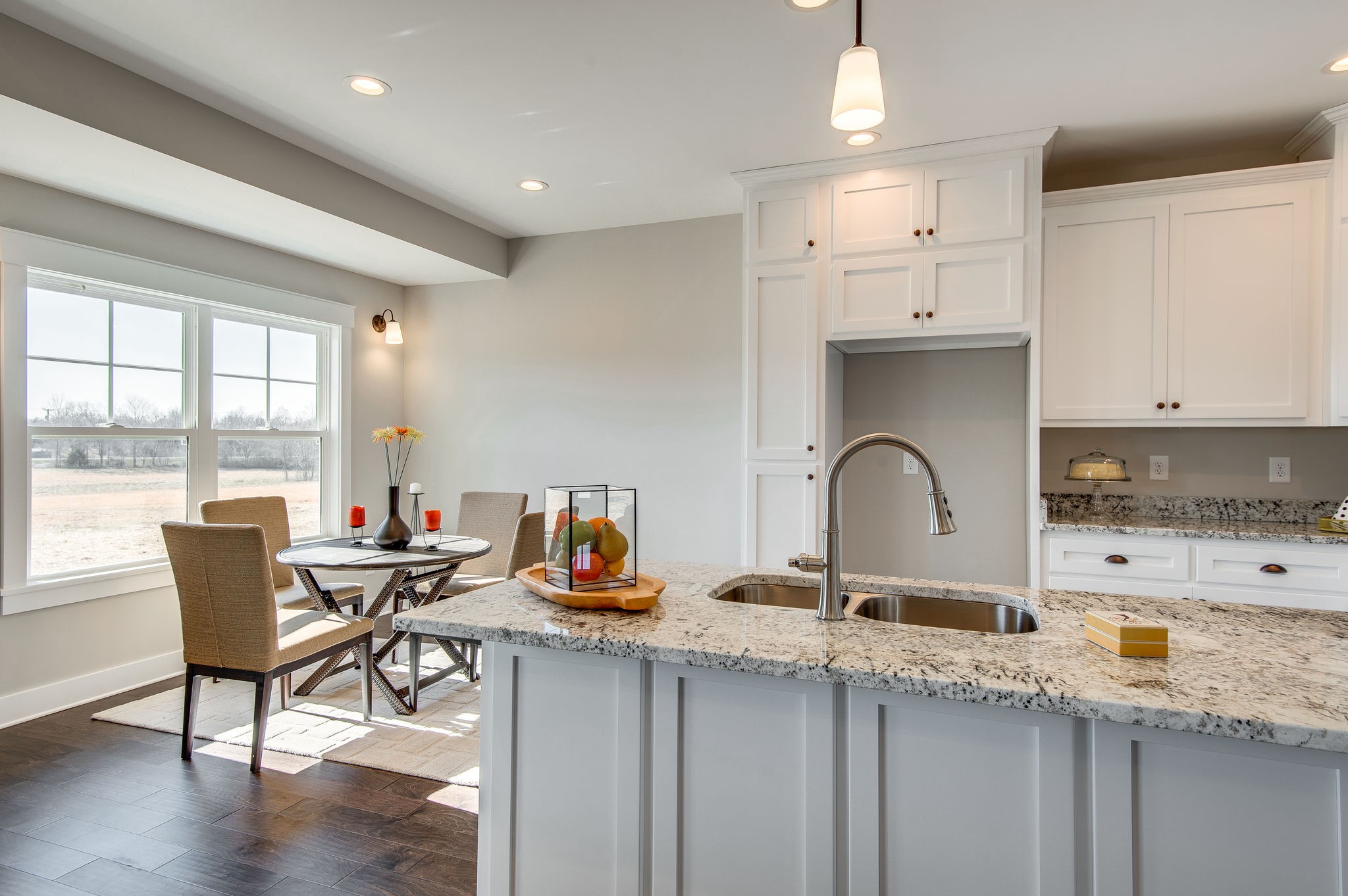 1026 Hayshed Road Dickson, TN 37055 - Photo 6 of 30 a kitchen with granite countertop a sink and white cabinets