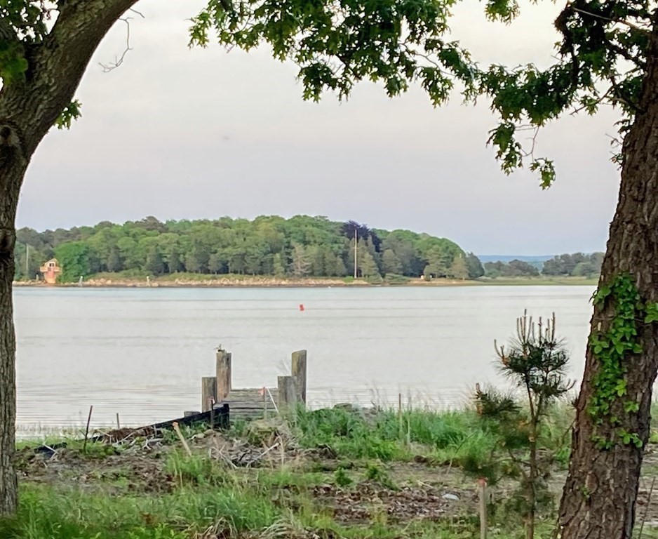 14 Over Jordan Road Wareham, MA 02571 - Photo 2 of 7 a view of a lake with houses in the back
