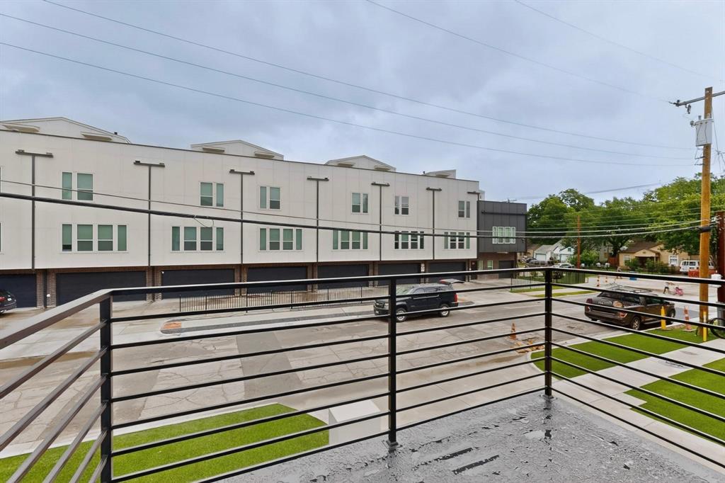 2226 Shea Road, Unit 103 Dallas, TX 75235 - Photo 25 of 35 Balcony with black metal railings overlooking a street