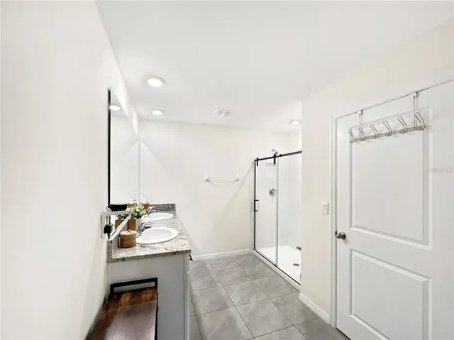 a room that has a bed and a table in it